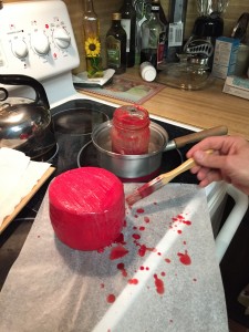 Applying wax to the cheddar cheese